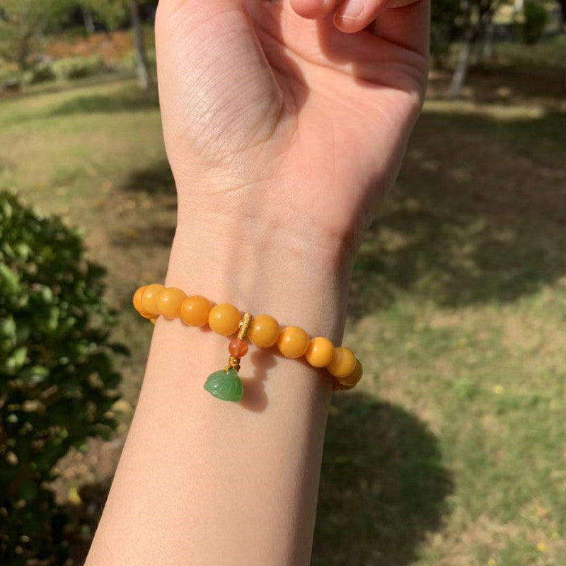 Lotus pod pendant natural beeswax bracelet